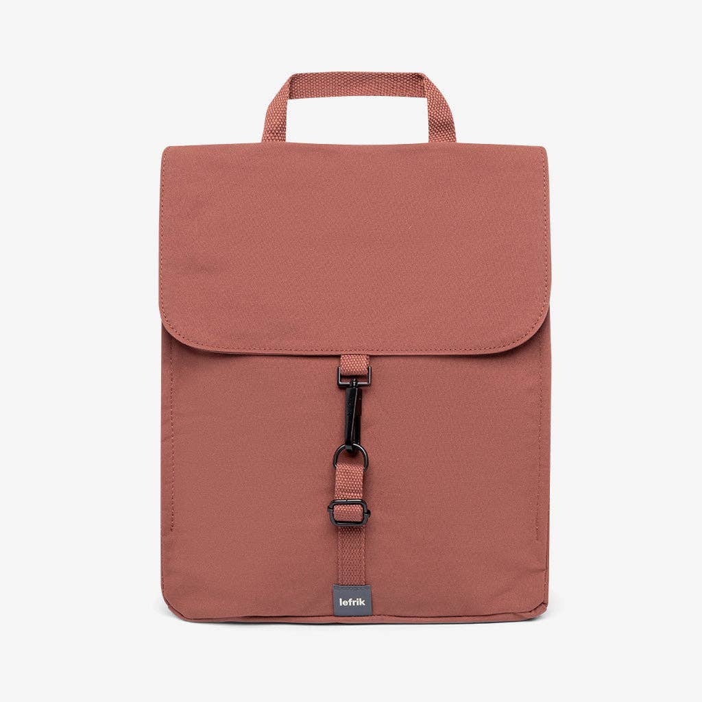 Brown backpack with a visible brand label on a white background
