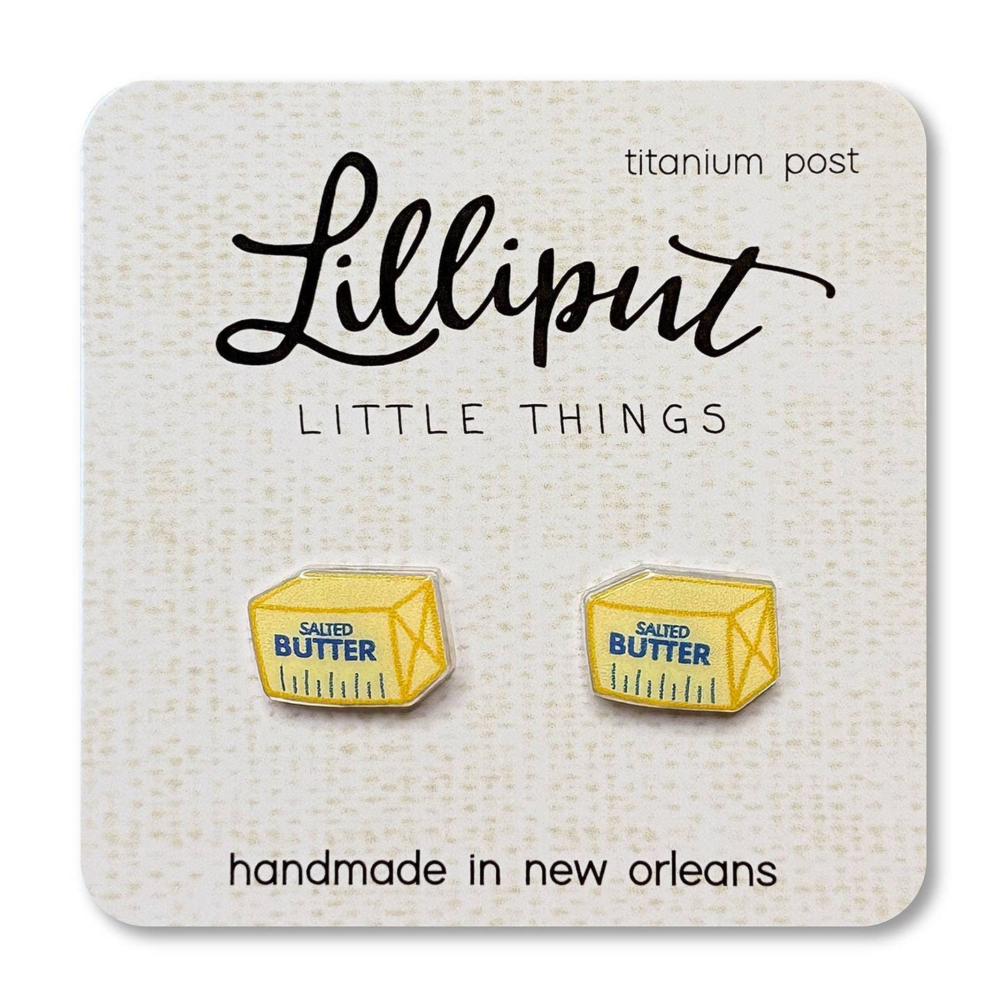 Butter container earrings on a Lilliput Little Things branded card.