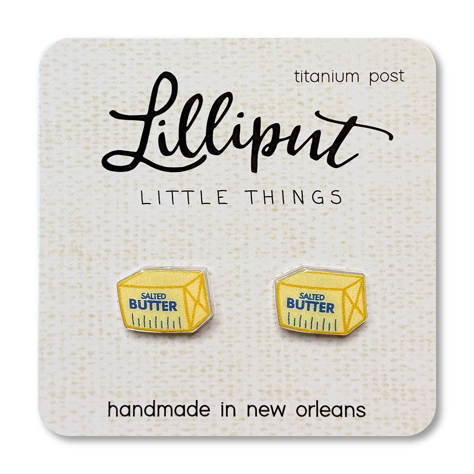 Butter container earrings on a Lilliput Little Things branded card.