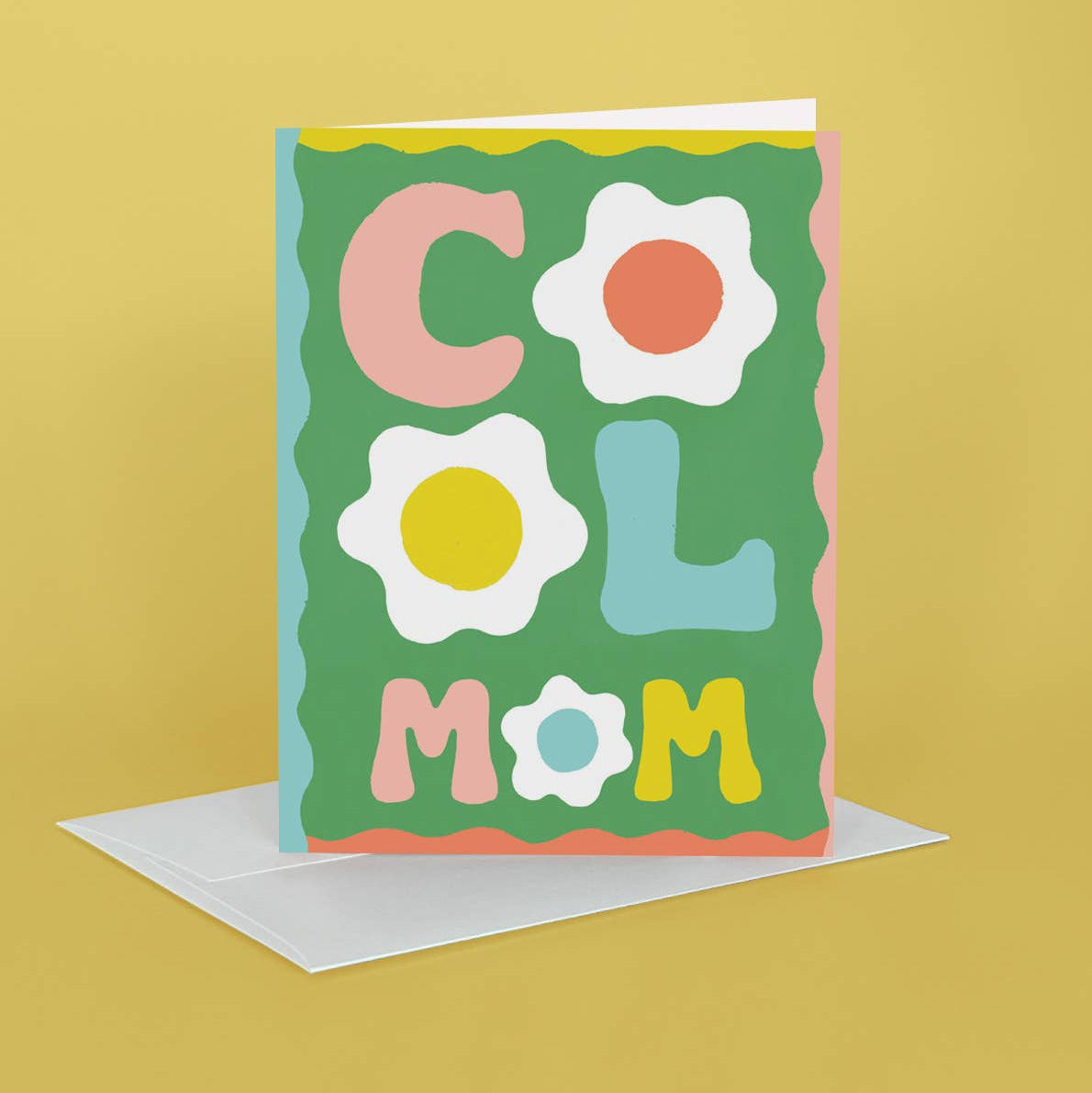 Colorful card with 'COOL MOM' text and flower graphics on a yellow background
