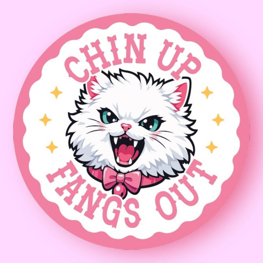 Cartoon cat with 'Chin Up, Fangs Out' text on a pink background