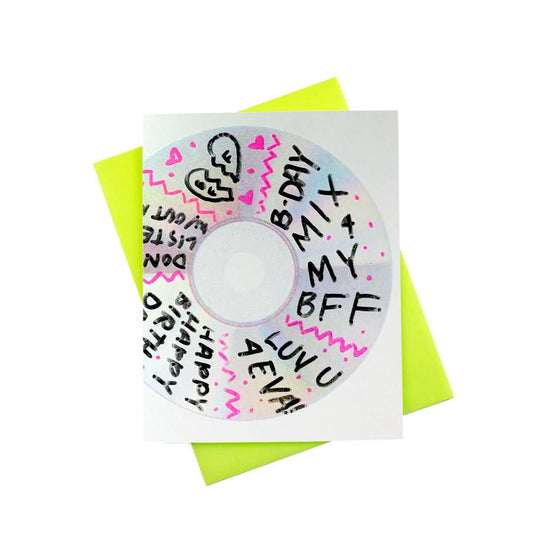 Circular card with handwritten text and a green envelope on a white background