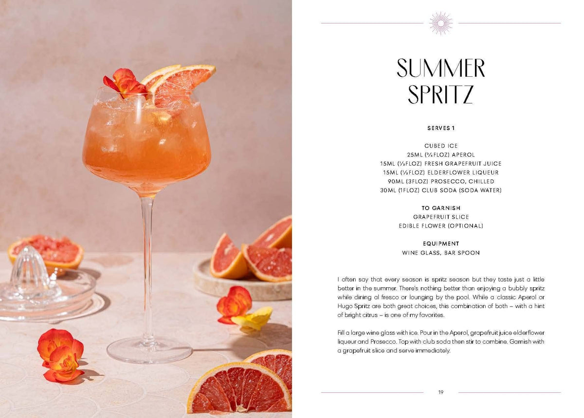 Cocktail in a glass with grapefruit slices and flowers, accompanied by a recipe card for 'Summer Spritz'.