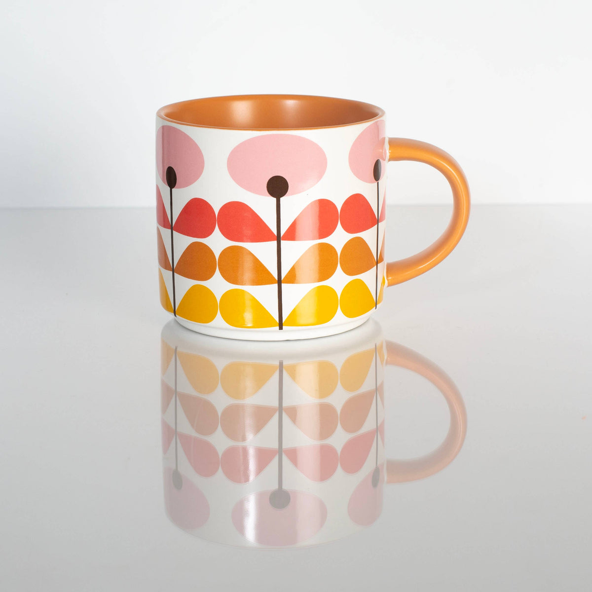 Colorful mug with floral pattern on a white background