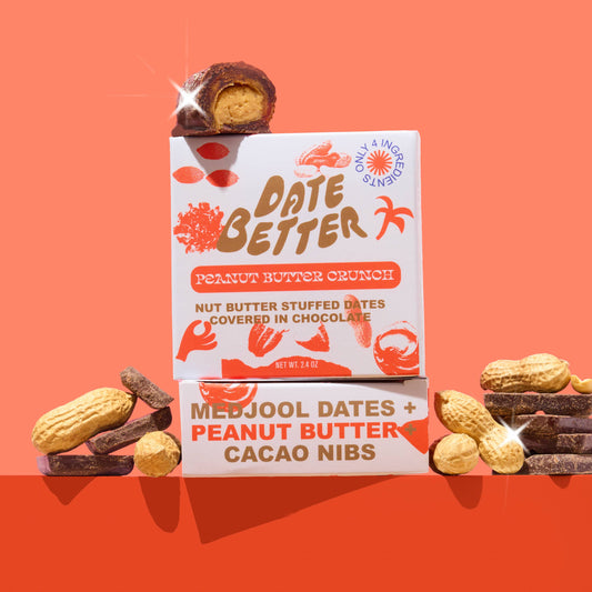 Date Better peanut butter crunch snack bar on an orange background