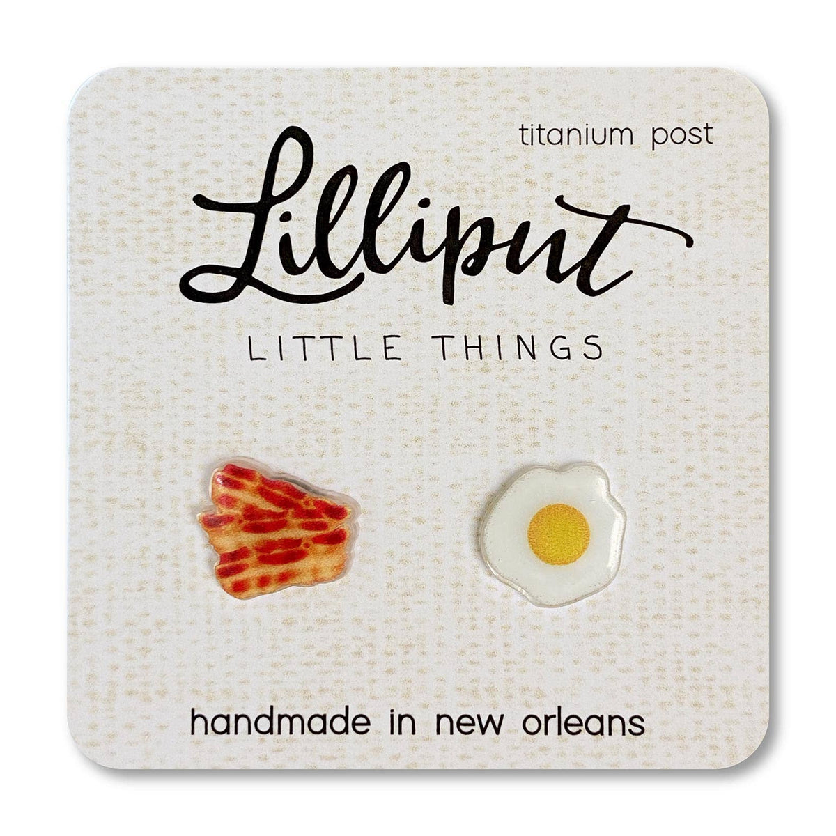 Earring set with bacon and egg design on a Lilliput Little Things card.