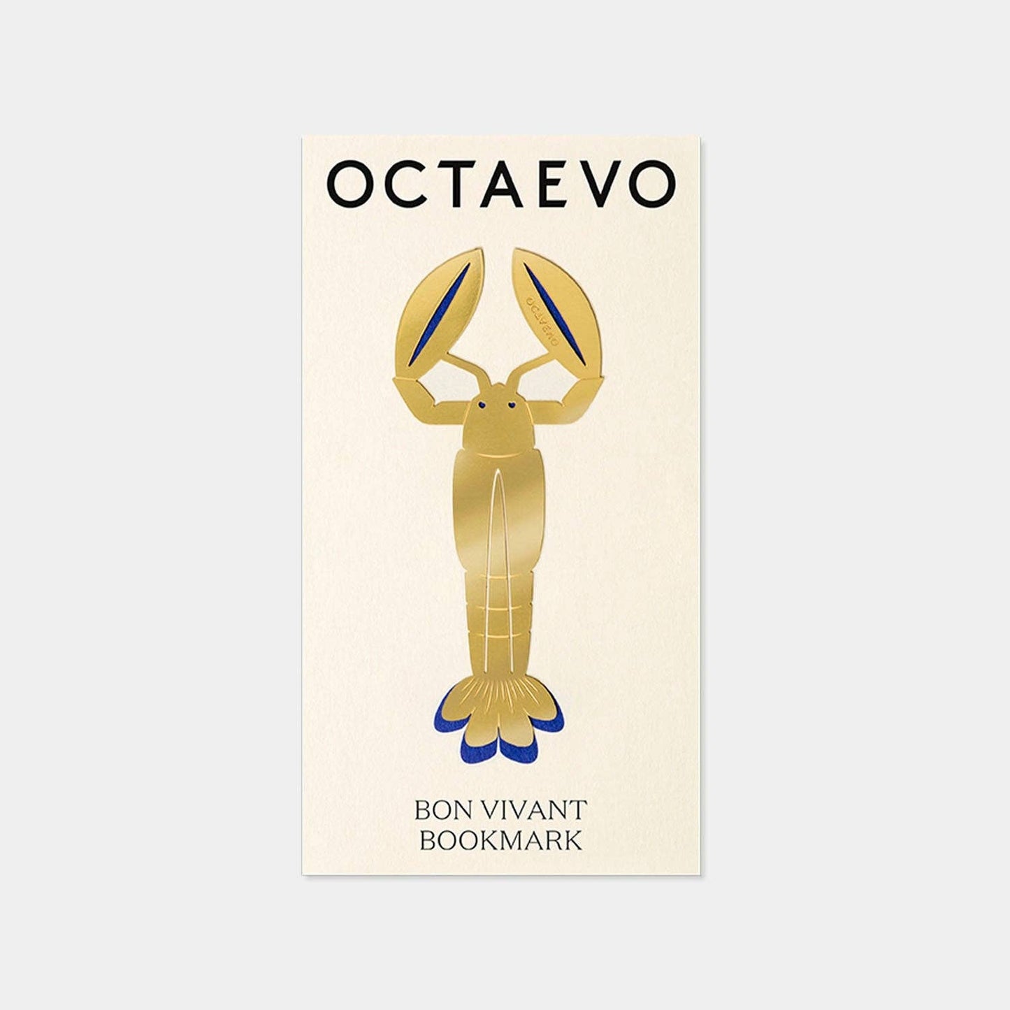 Gold lobster bookmark with 'OCTAEVO' branding on a light beige background