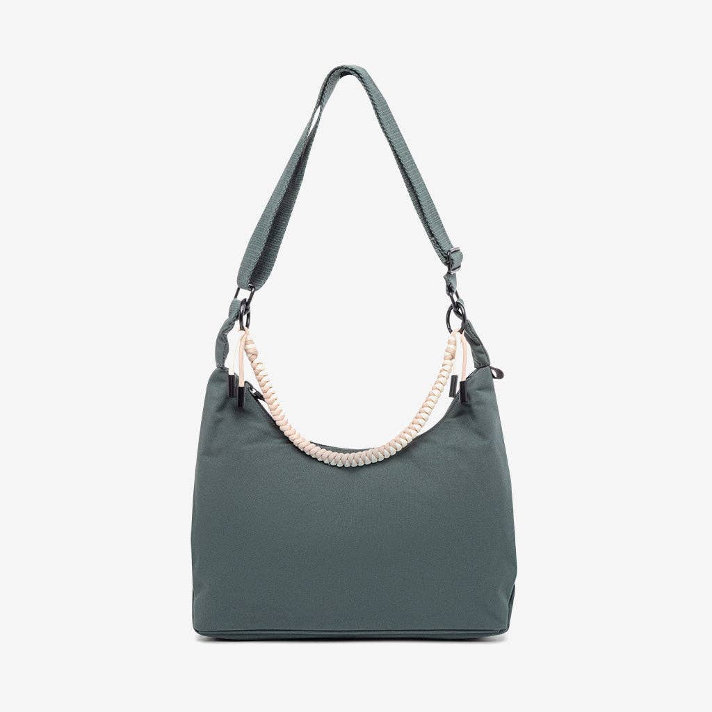 Green handbag with a braided handle on a white background