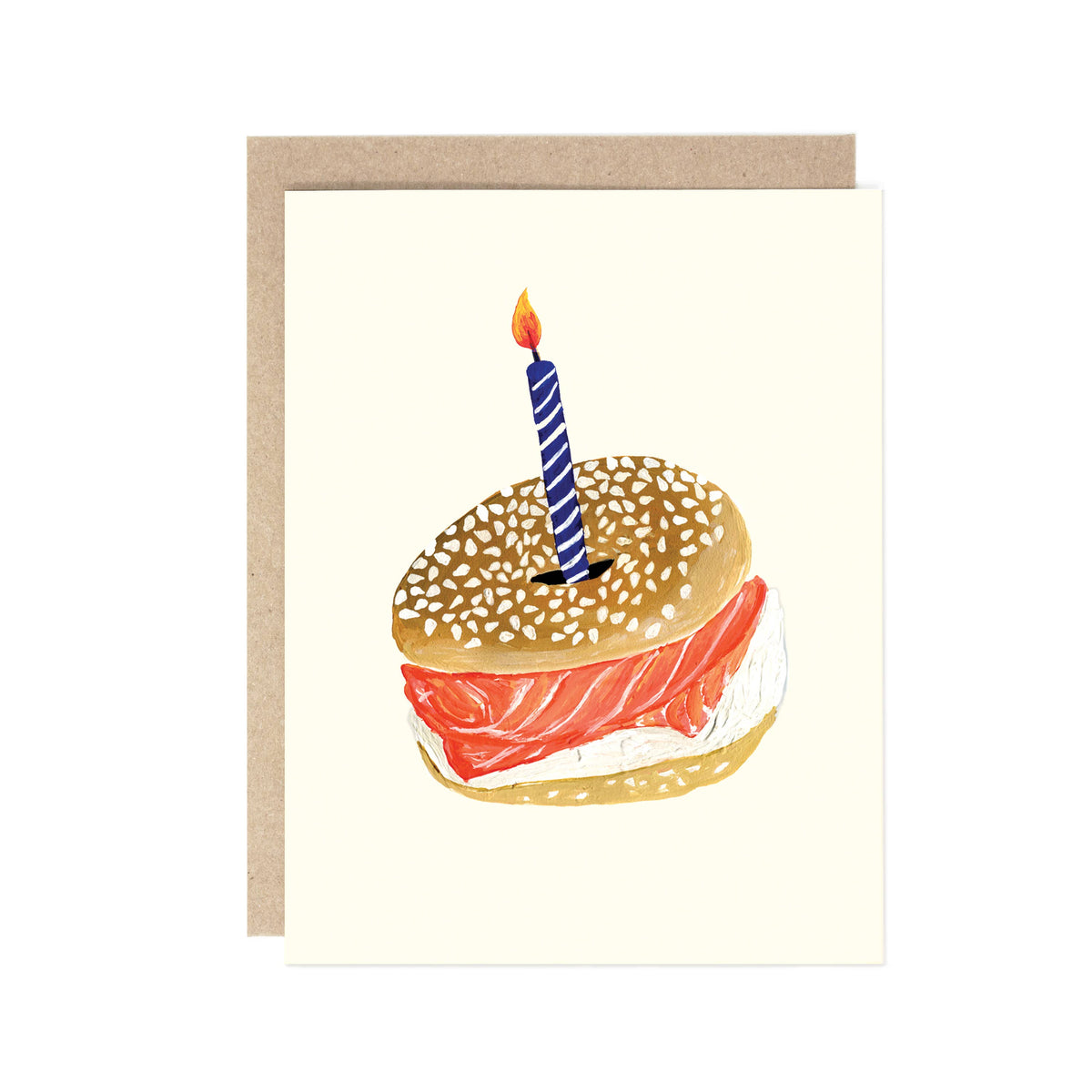 Greeting card with a bagel sandwich with salmon and cream cheese and a lit candle on top, on a white background.