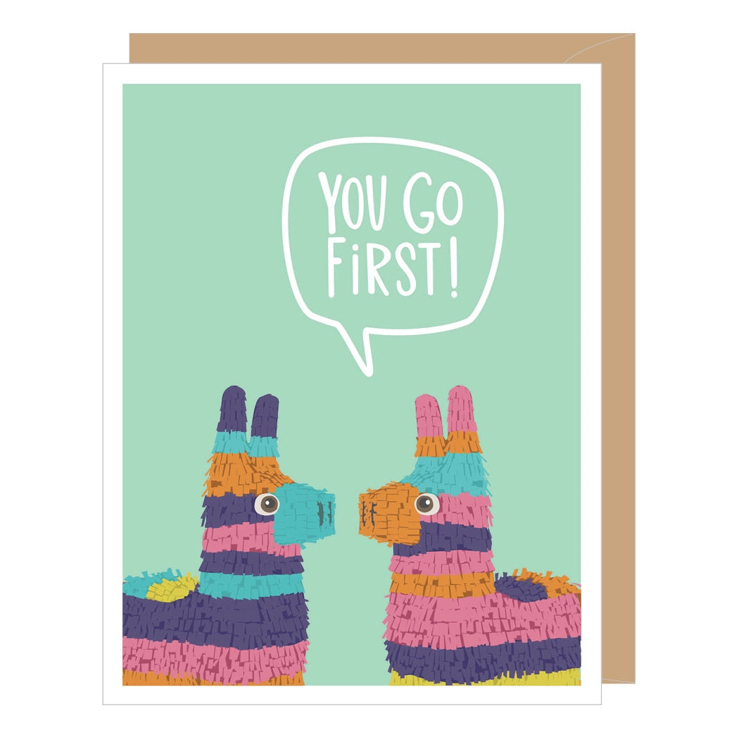 Greeting card with two colorful llamas facing each other and a speech bubble saying 'You Go First!' on a light green background.