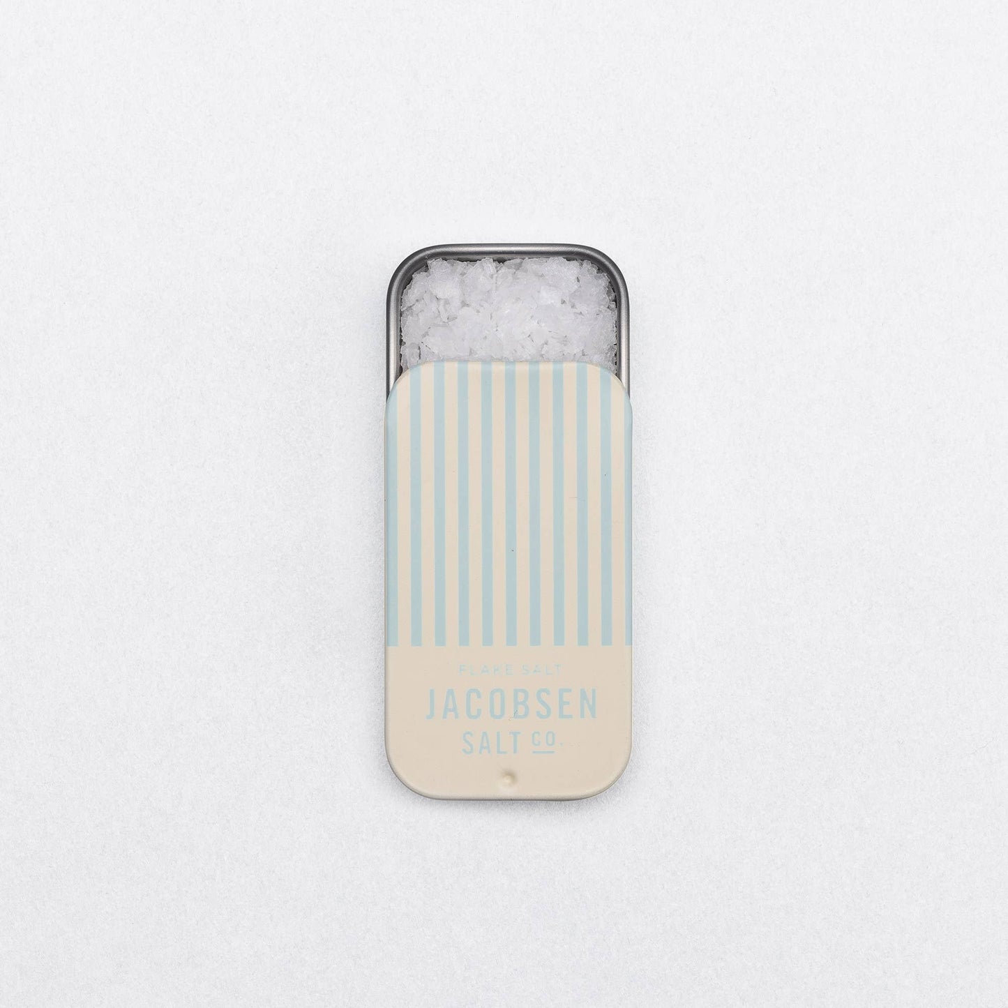 Phone case with striped design and 'Jacobsen Salt Co.' branding on a light gray background