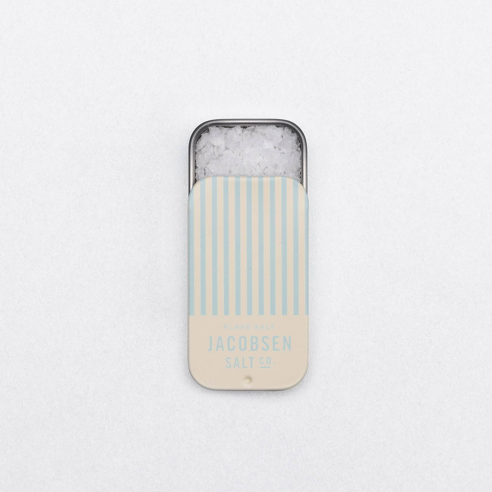 Phone case with striped design and 'Jacobsen Salt Co.' branding on a light gray background