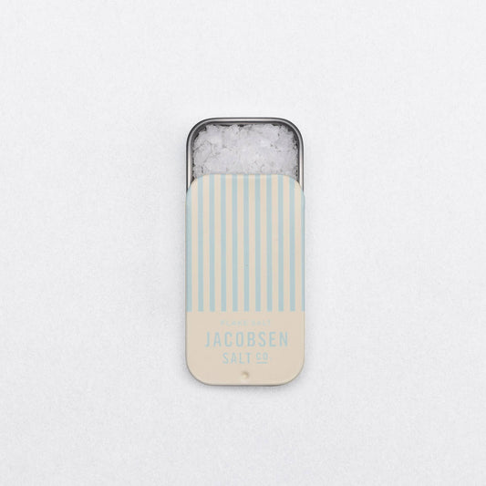 Phone case with striped design and 'Jacobsen Salt Co.' branding on a light gray background