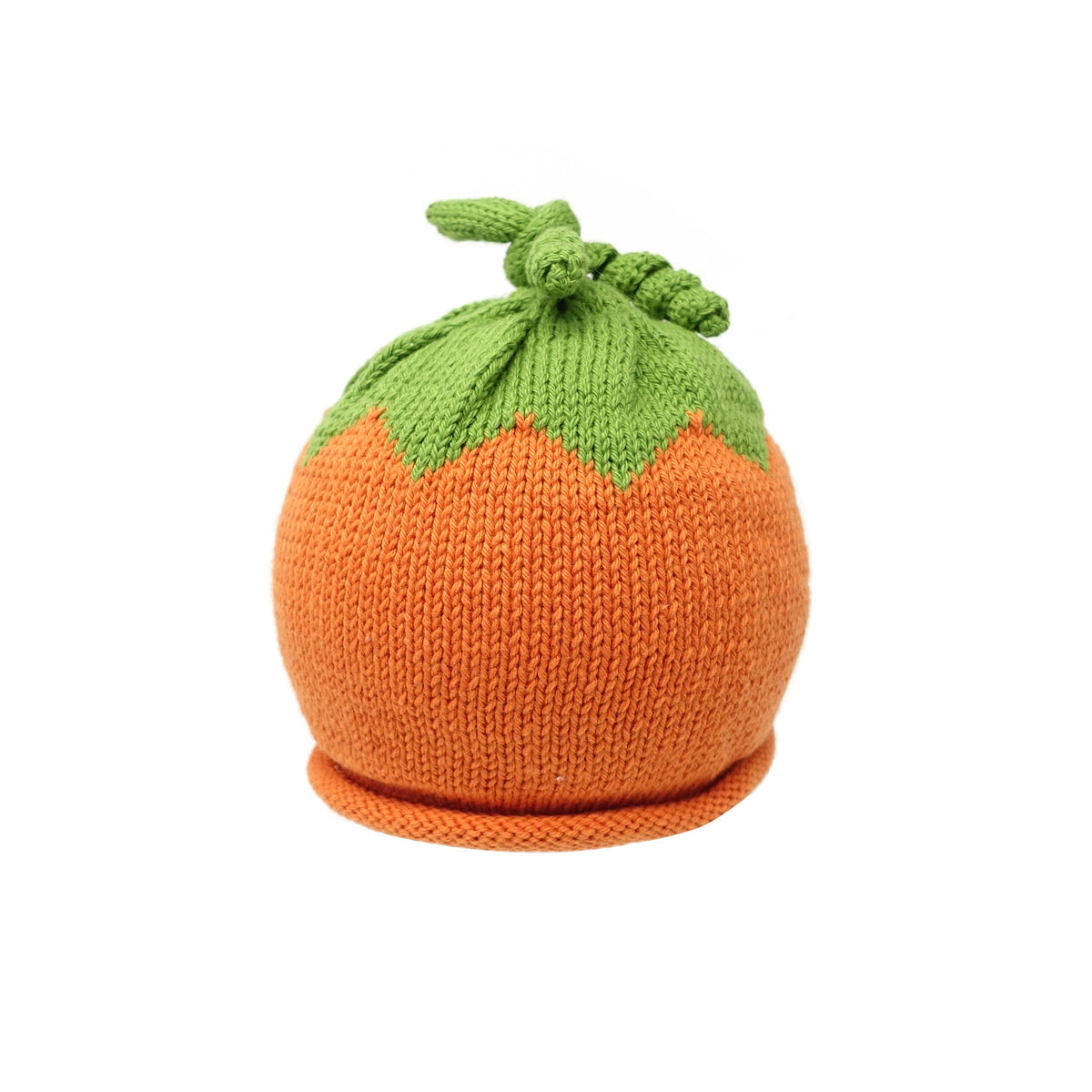 Knitted pumpkin hat with green top on a white background