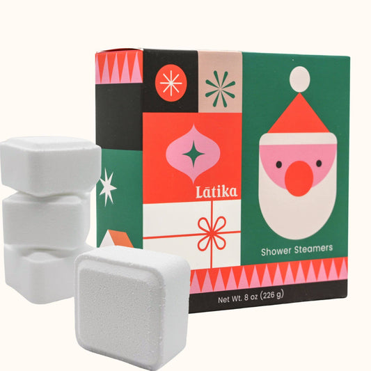 Látika shower steamers with a colorful box featuring a Santa Claus design on a white background.