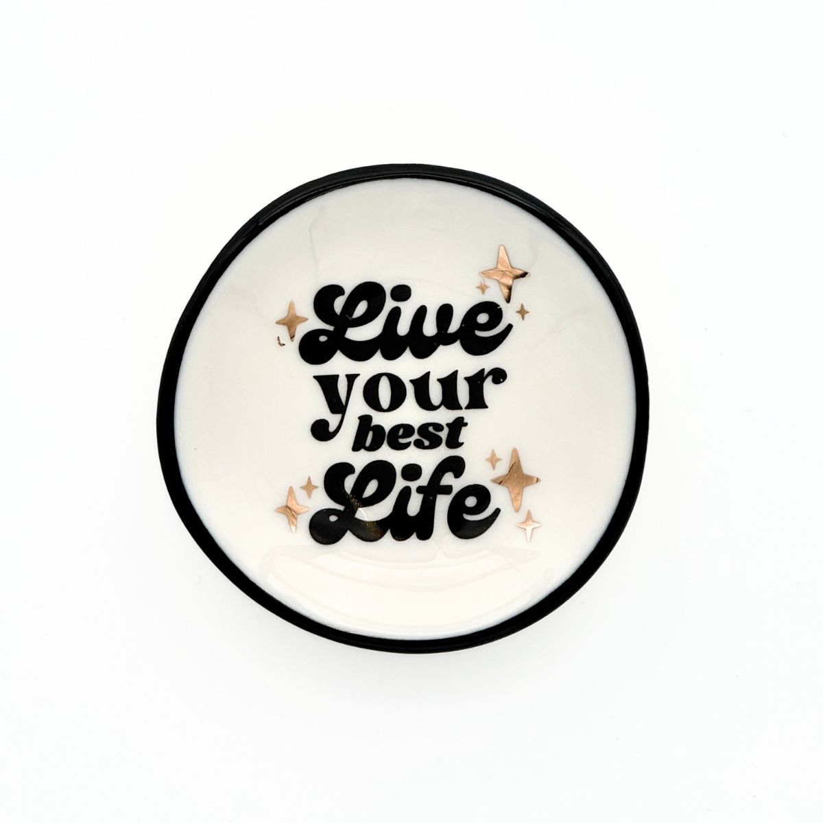 Round white coaster with 'Live your best life' text and decorative stars on a white background