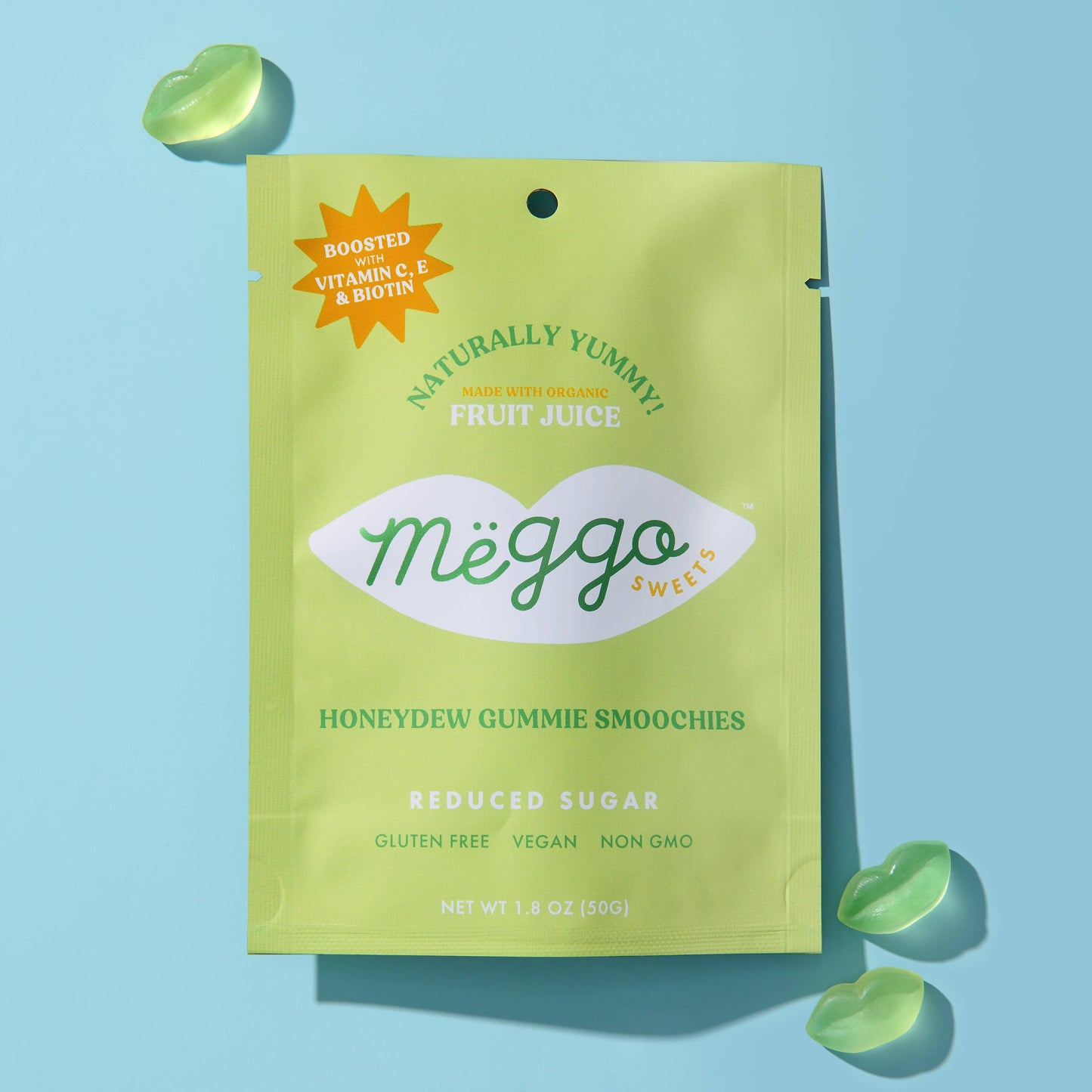 Green package of Meggo Honeydew Gummy Smoochies on a light blue background