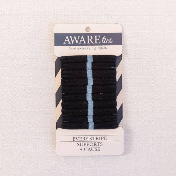 Packaged hair ties with a visible brand label on a light gray background
