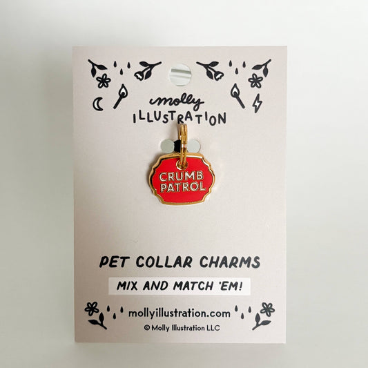 Pet collar charm on a Molly Illustration branded card with 'Crumbs Patrol' design.
