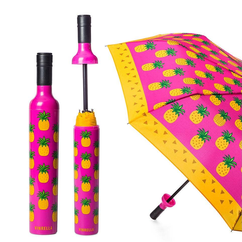 Pink umbrella with pineapple pattern on a white background