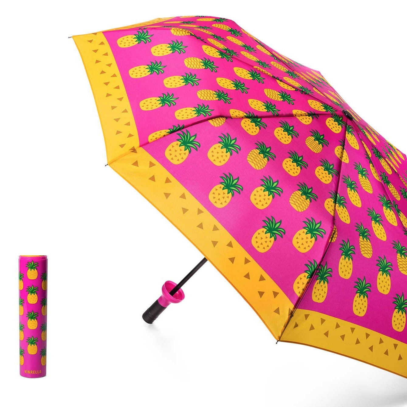Pink umbrella with pineapple pattern on a white background