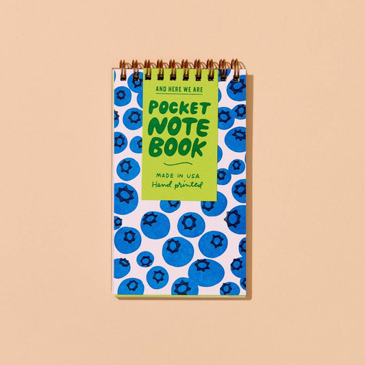 Pocket notebook with blueberry pattern on a beige background