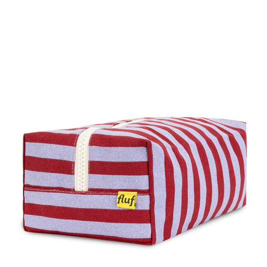 Red and white striped pet bed with 'fluf' label on a white background