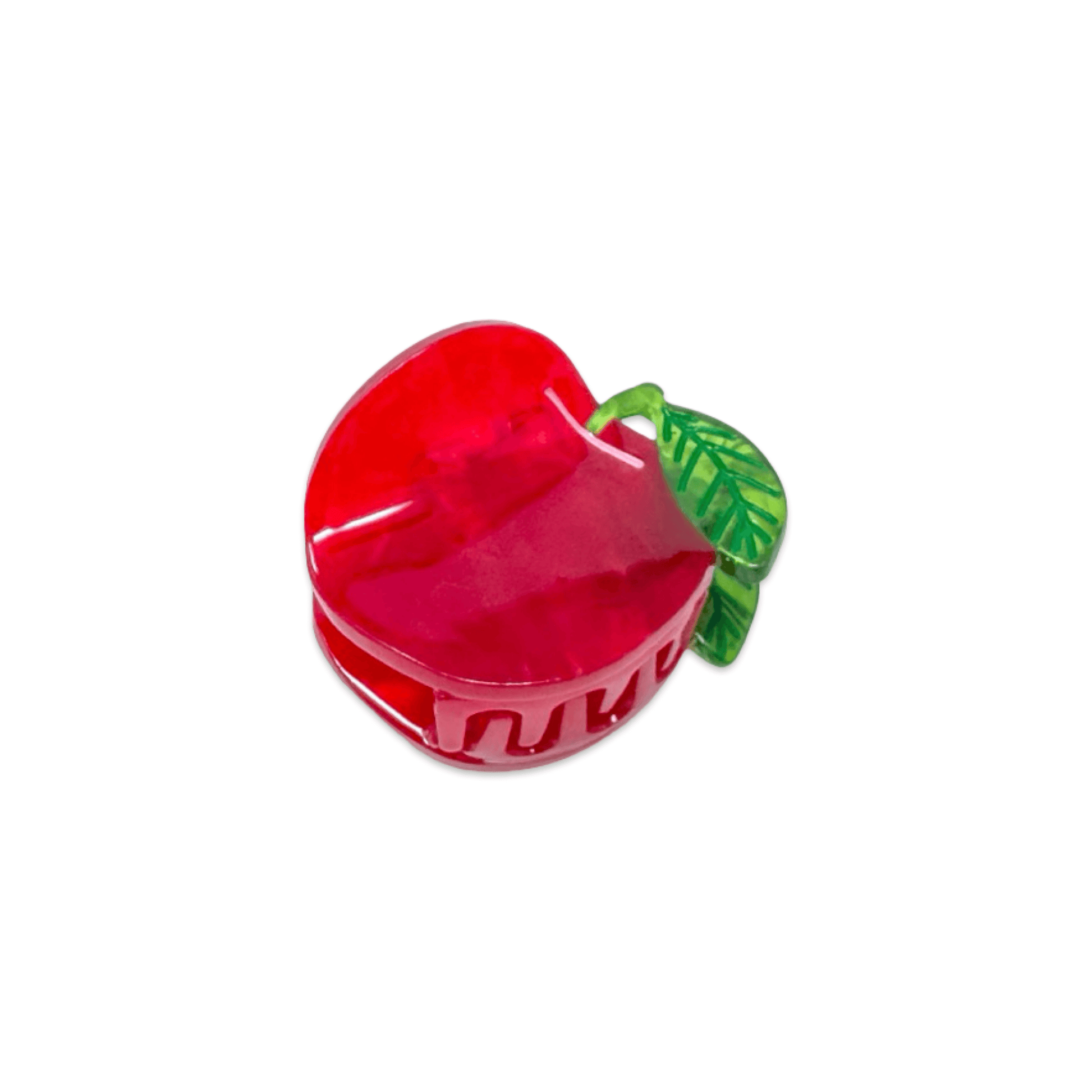 Red apple-shaped container with a green leaf on a white background