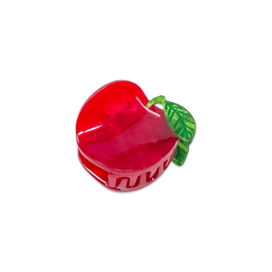 Red apple-shaped container with a green leaf on a white background