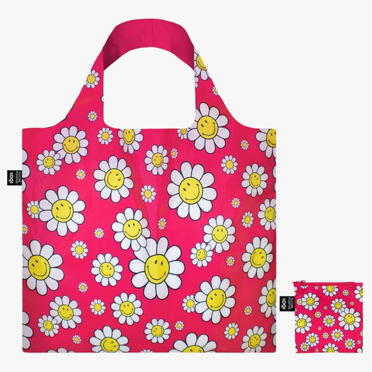 Reusable shopping bag with smiley flower pattern on a pink background
