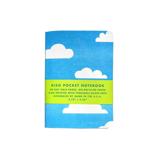 Riso pocket notebook with blue cover and white clouds on a white background
