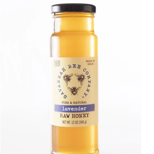 Bottle of Savannah Bee Company lavender raw honey on a white background