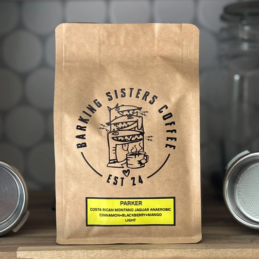 Barking Sisters Coffee package with branding and product details on a wooden surface.