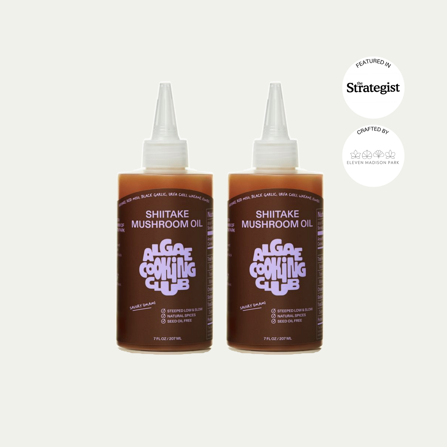Two bottles of Alga & Co. Cooking Club Shiitake Mushroom Oil on a white background.