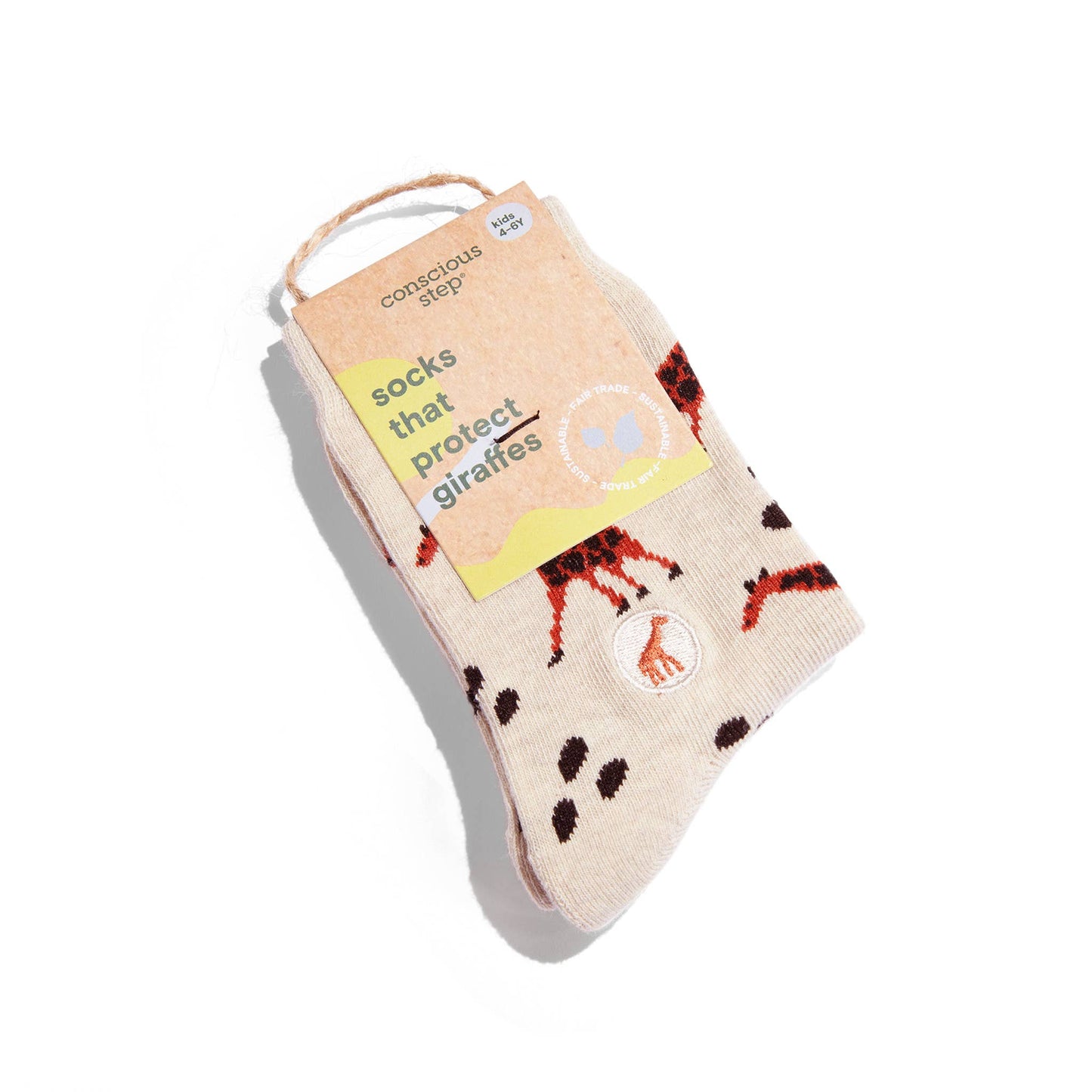 Sock with giraffe pattern and packaging on a white background