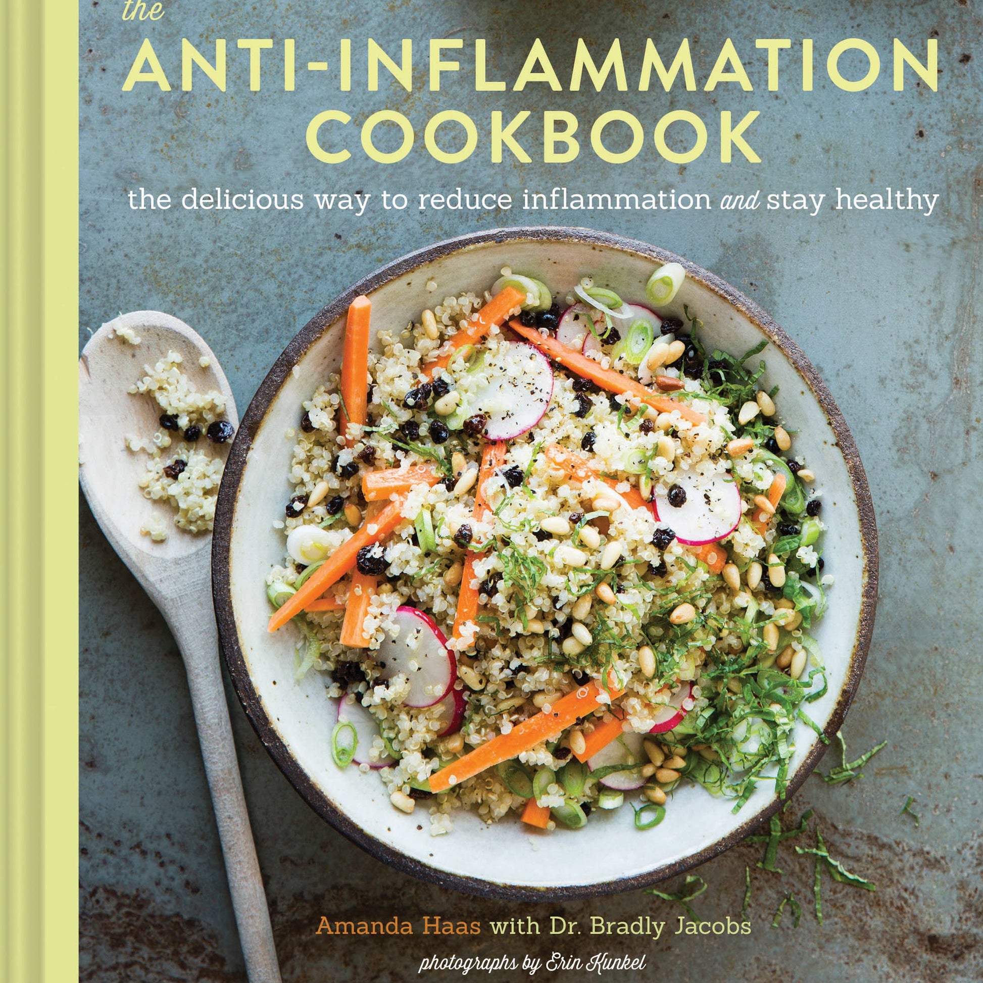 Book cover of 'The Anti-Inflammation Cookbook' with a bowl of salad and ingredients on a rustic background.