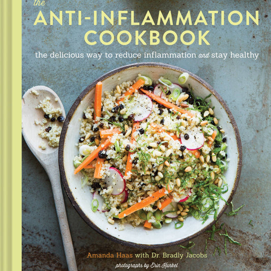 Book cover of 'The Anti-Inflammation Cookbook' with a bowl of salad and ingredients on a rustic background.