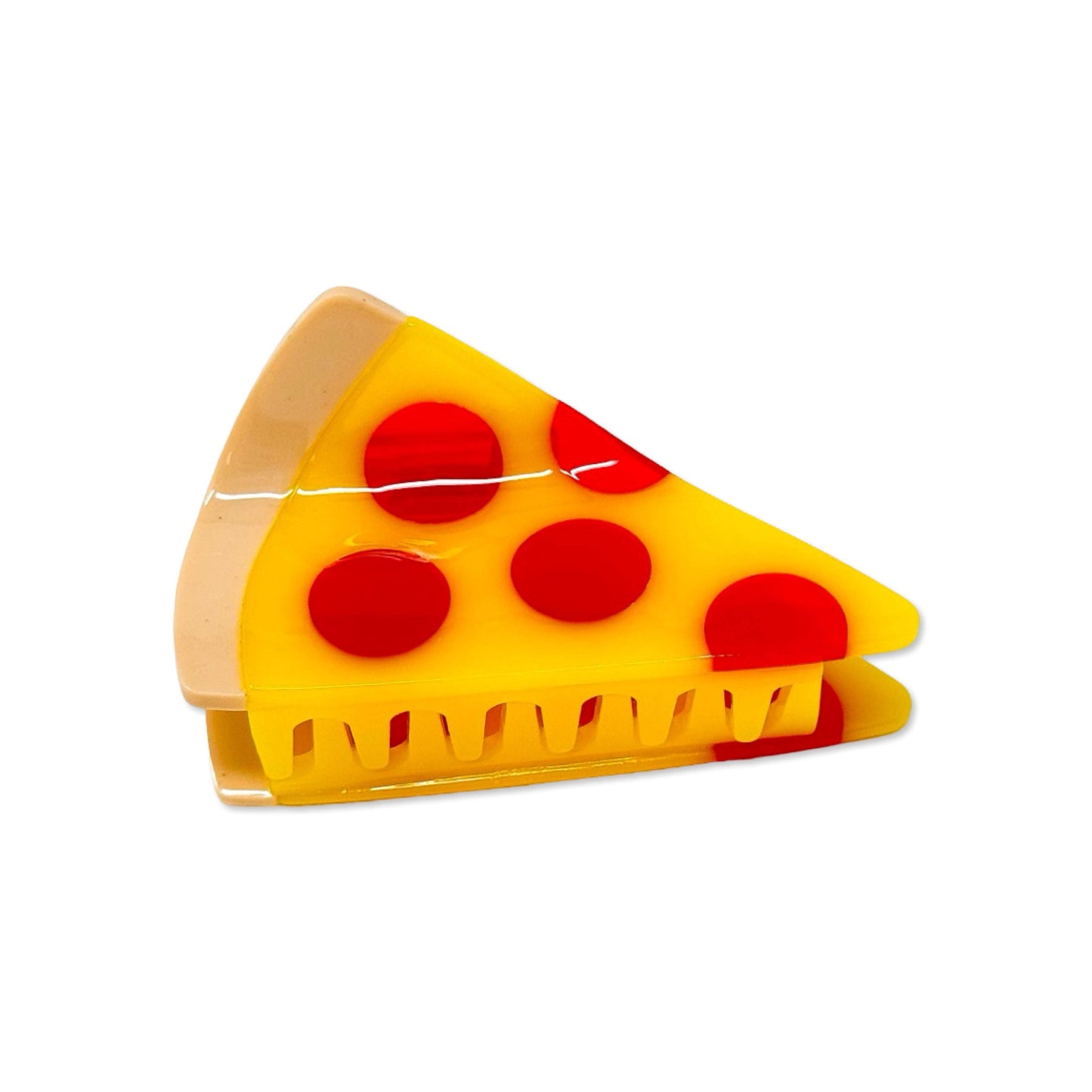 Toy pizza slice with yellow cheese and red pepperoni on a white background