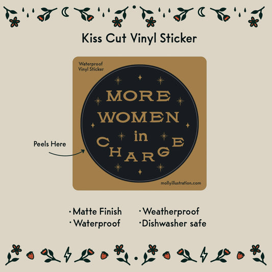 Vinyl sticker with 'More Women in Charge' text on a beige background