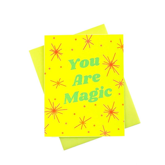 Yellow card with 'You Are Magic' text and red starburst designs on a white background
