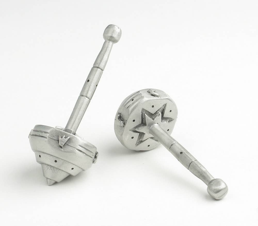 Metallic salt and pepper shakers on a white background
