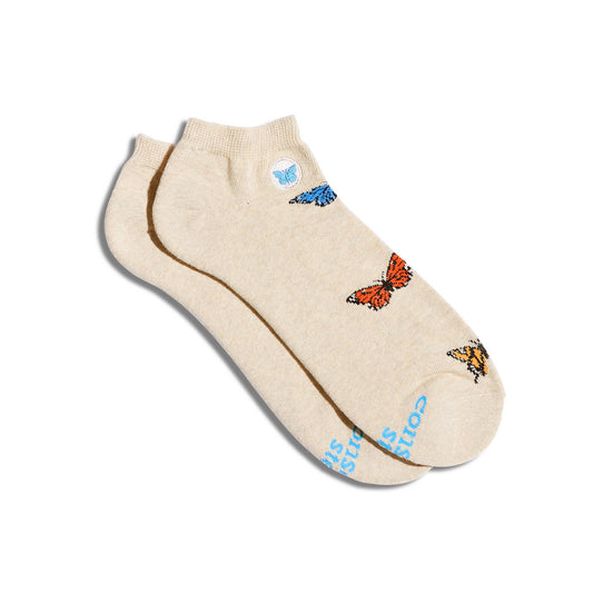 Beige ankle sock with butterfly designs on a white background