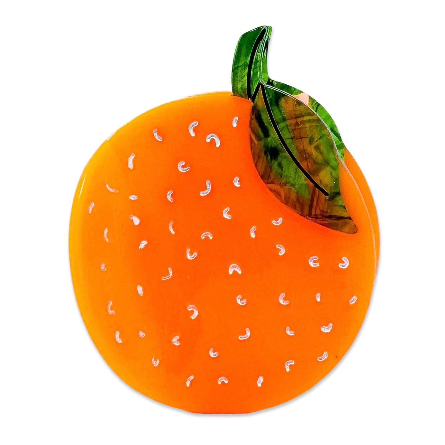 Orange with white pattern and green leaf on a white background