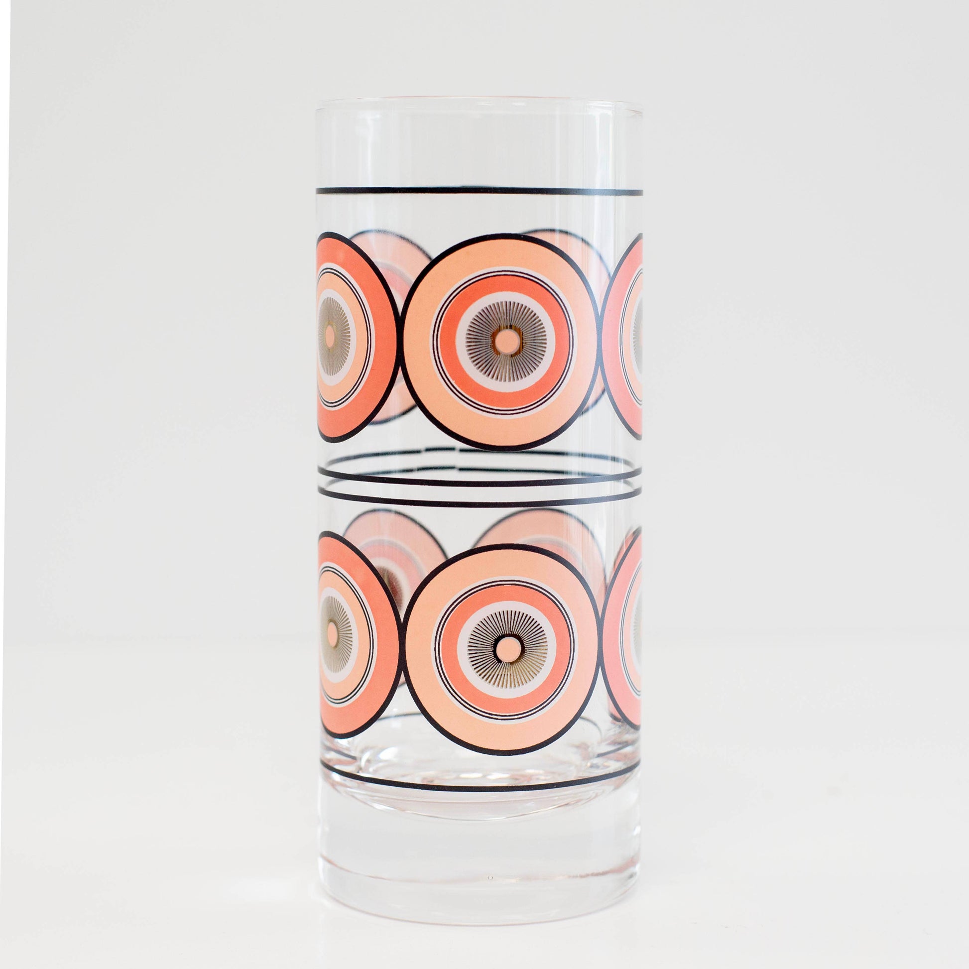 Glass with circular pattern on a white background