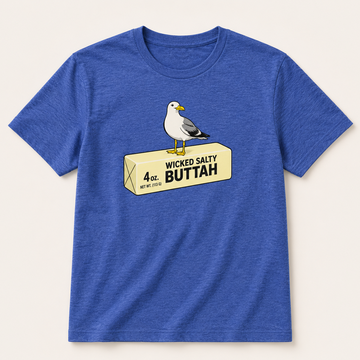 Blue t-shirt with a graphic of a seagull on a butter package and text 'Wicked Salty BUTTAH' on a beige background.