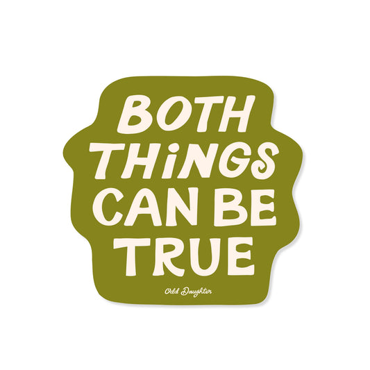 Green sticker with white text 'Both Things Can Be True' on a white background