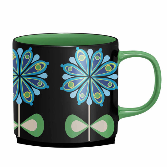 Mug with blue and green floral design on a black background