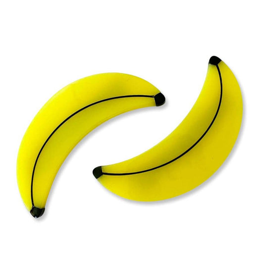 Two yellow bananas on a white background