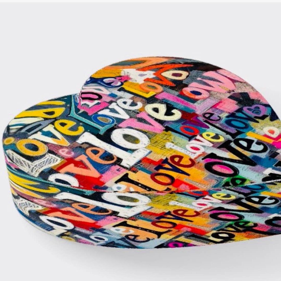 Heart-shaped box with colorful 'love' text design on a white background