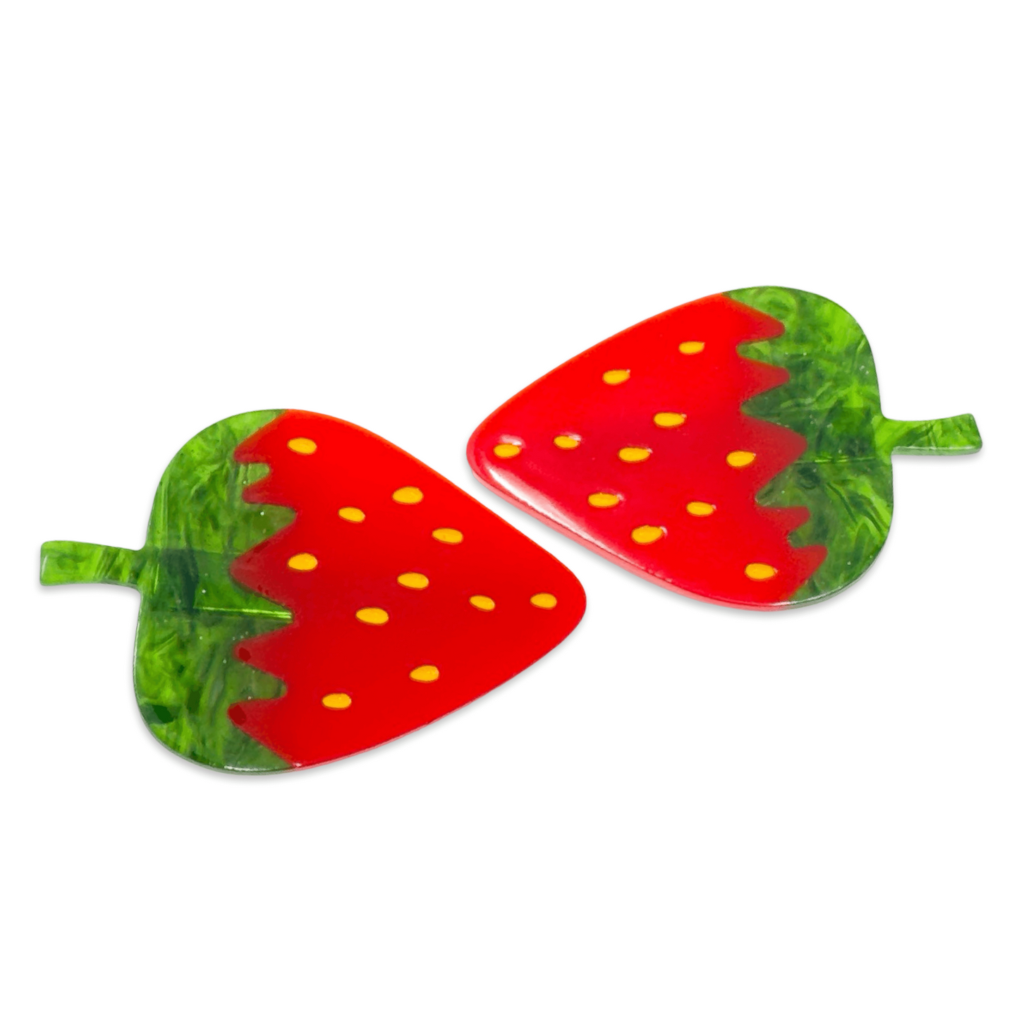 Strawberry-shaped earrings on a white background
